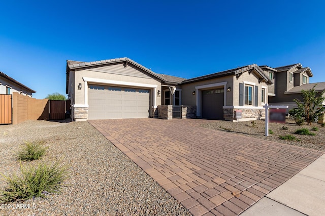 ranch-style house featuring a garage