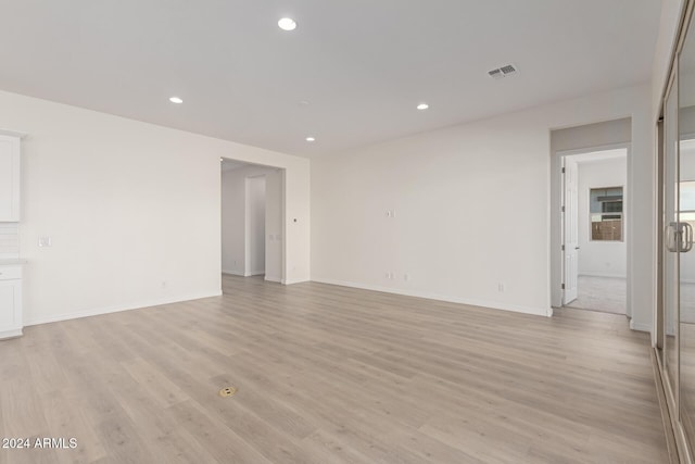 unfurnished living room with light hardwood / wood-style floors