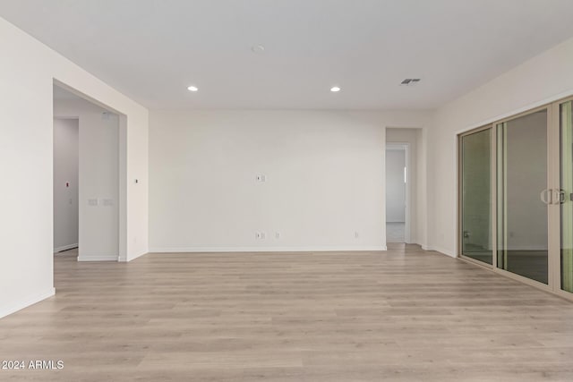 unfurnished room featuring light hardwood / wood-style flooring