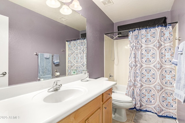 full bathroom featuring vanity, visible vents, shower / bath combination with curtain, tile patterned floors, and toilet