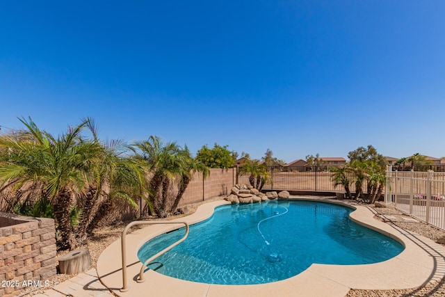 view of swimming pool with a fenced in pool and a fenced backyard