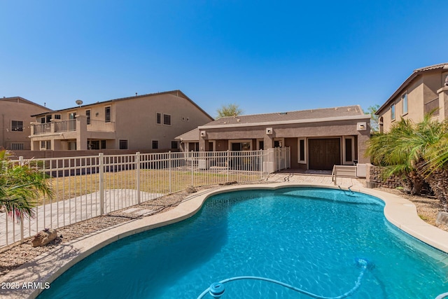 view of swimming pool featuring a fenced in pool, a yard, and fence