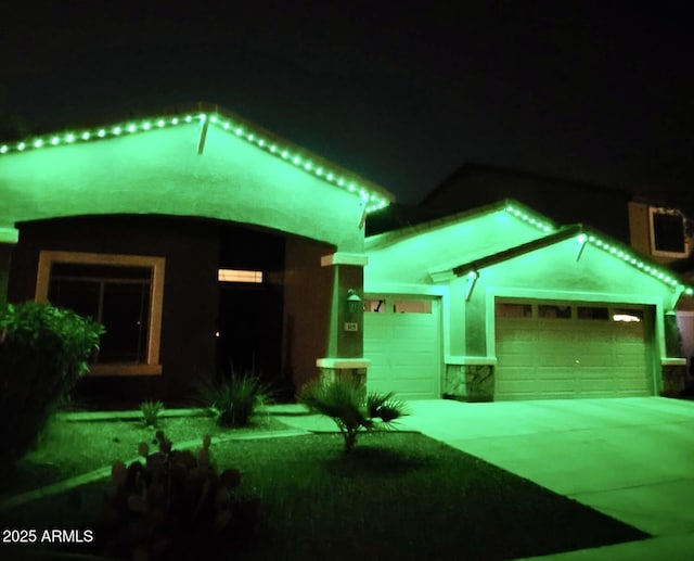 view of front of home featuring driveway and a garage