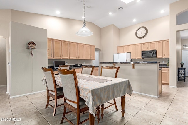 dining area featuring light tile patterned flooring, recessed lighting, visible vents, and high vaulted ceiling