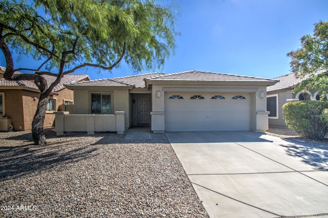 view of front of property featuring a garage