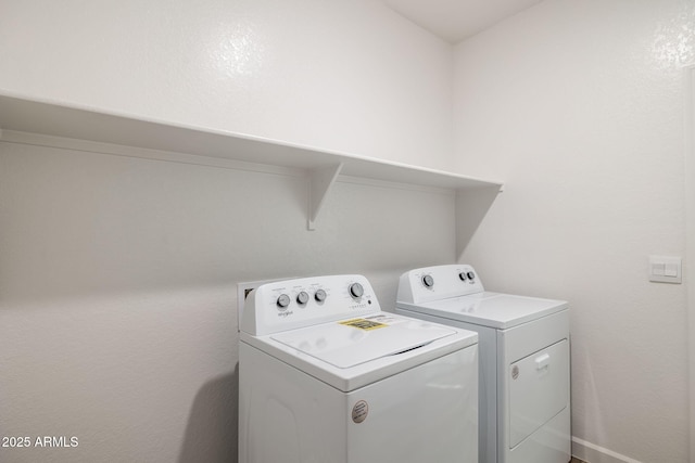 clothes washing area featuring laundry area and independent washer and dryer