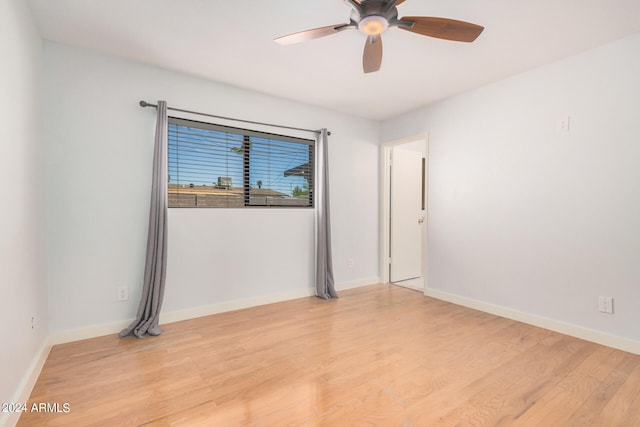 empty room with light hardwood / wood-style floors and ceiling fan