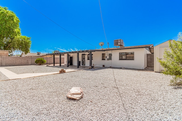 rear view of property featuring a patio area