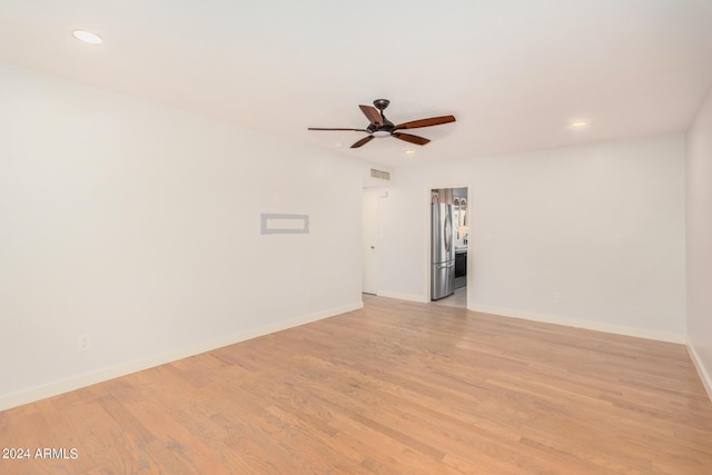 spare room featuring recessed lighting, visible vents, a ceiling fan, light wood-type flooring, and baseboards