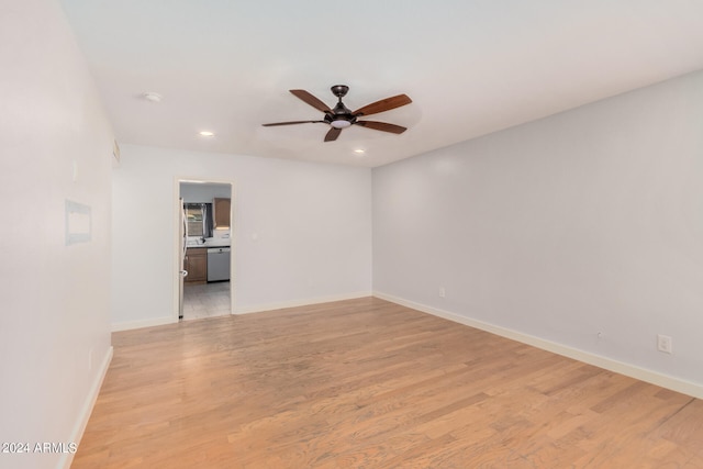 tiled spare room featuring ceiling fan