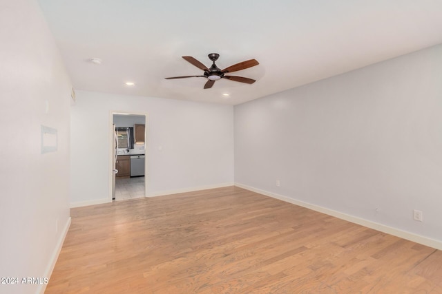 empty room with light wood-style floors, ceiling fan, baseboards, and recessed lighting