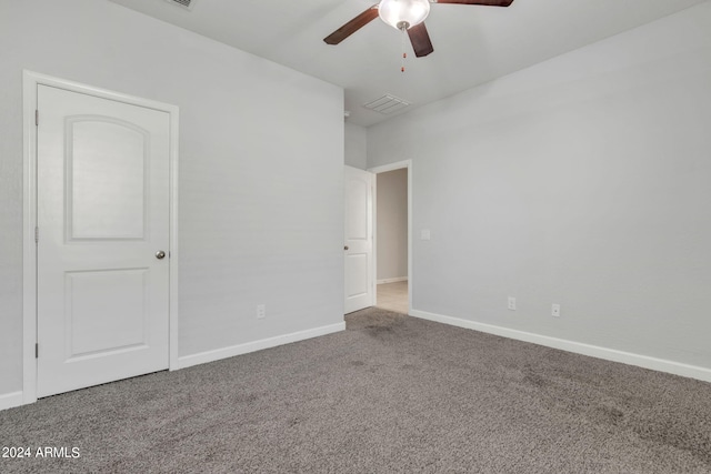 spare room with ceiling fan and carpet flooring