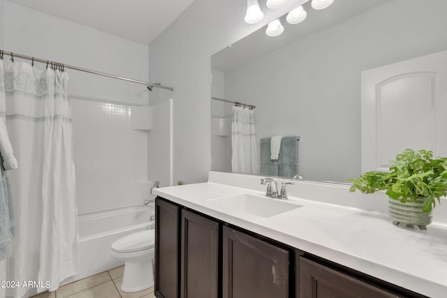 full bathroom featuring vanity, tile patterned floors, toilet, and shower / tub combo with curtain