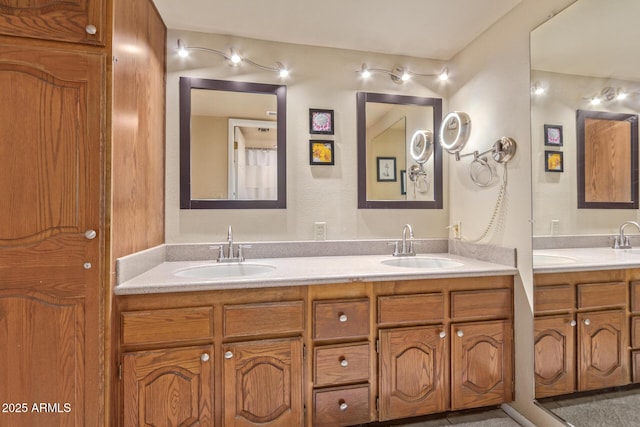 full bathroom featuring double vanity and a sink