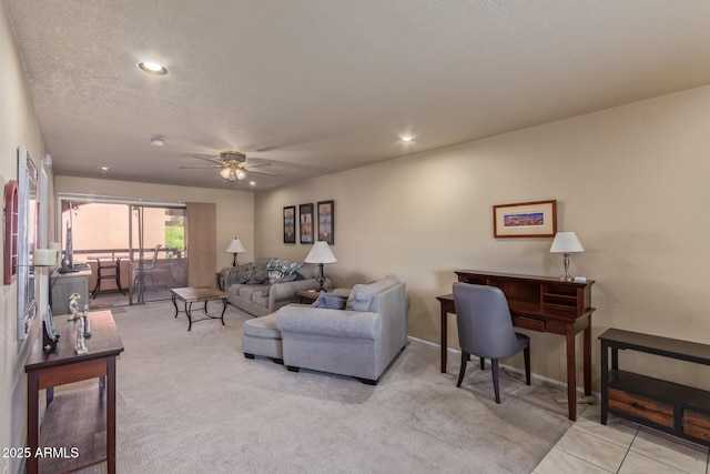 living area with recessed lighting, a ceiling fan, carpet, and baseboards