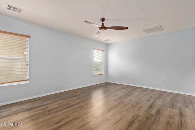 unfurnished room featuring hardwood / wood-style flooring and ceiling fan