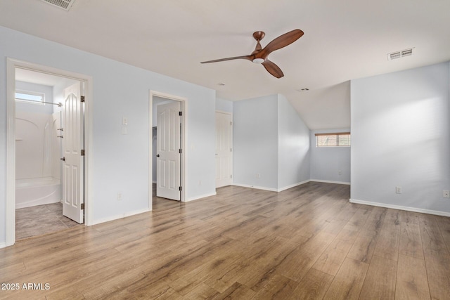 unfurnished living room featuring ceiling fan and light hardwood / wood-style flooring