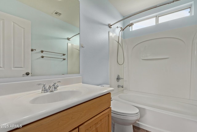 full bathroom featuring shower / tub combination, vanity, and toilet