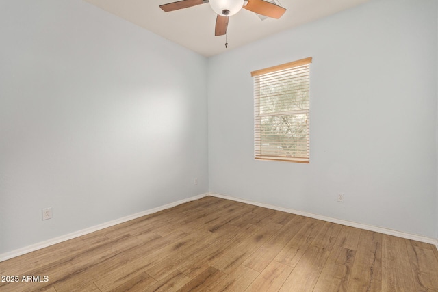 empty room featuring ceiling fan and light hardwood / wood-style flooring