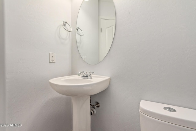 bathroom featuring toilet