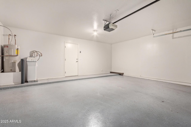 garage with water heater and a garage door opener