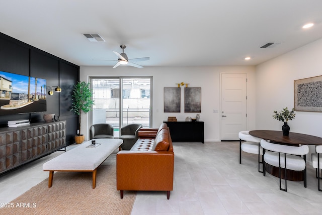 living area with recessed lighting, visible vents, and ceiling fan