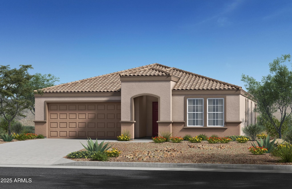 24661 W Jessica Ln, Buckeye, AZ 85326 - mediterranean / spanish home with an attached garage, a tiled roof, driveway, and stucco siding