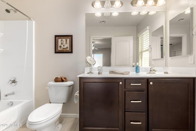 full bathroom featuring vanity, ceiling fan, toilet, and shower / bath combination