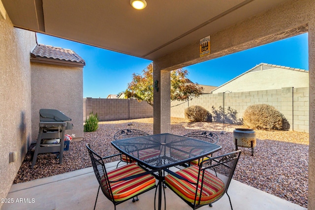 view of patio featuring a grill