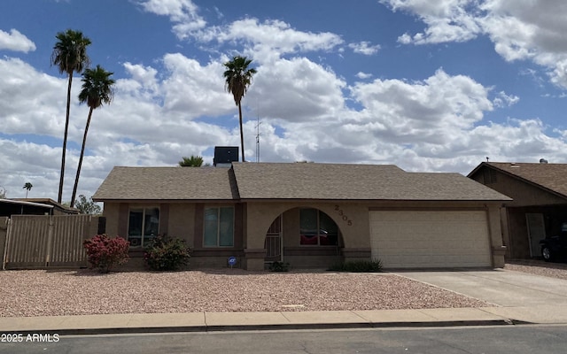 single story home with stucco siding, concrete driveway, a garage, and fence