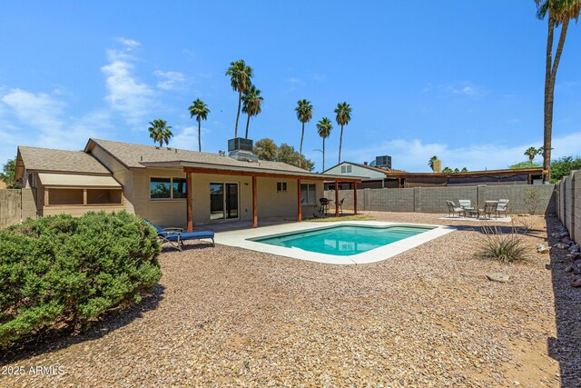view of swimming pool with a fenced backyard and a patio