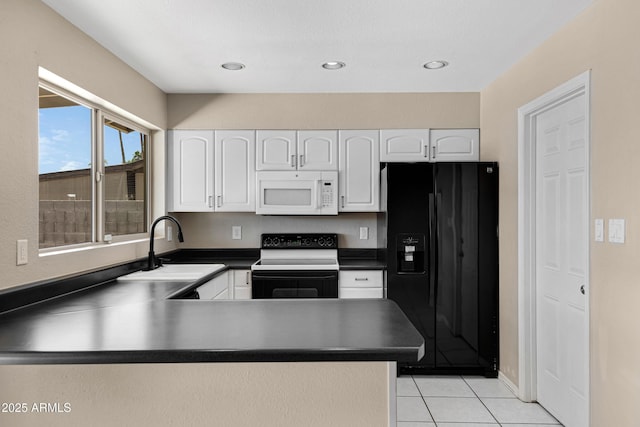kitchen with white microwave, black refrigerator with ice dispenser, electric range oven, dark countertops, and a sink