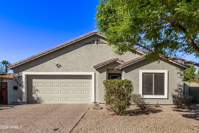 single story home featuring a garage