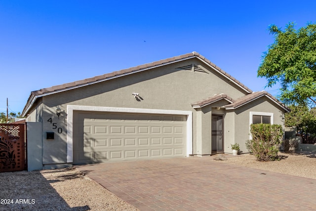 single story home featuring a garage