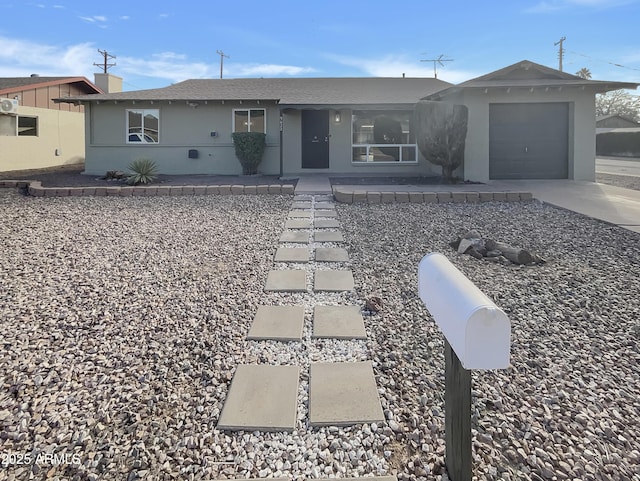 single story home featuring a garage