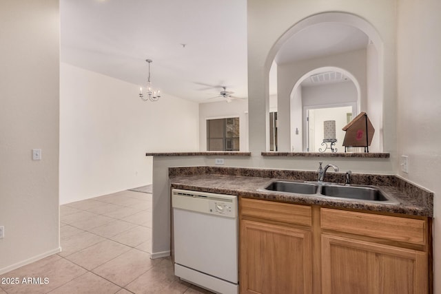 kitchen featuring light tile patterned flooring, sink, hanging light fixtures, ceiling fan, and white dishwasher