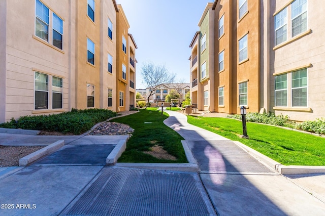 view of property's community with a yard