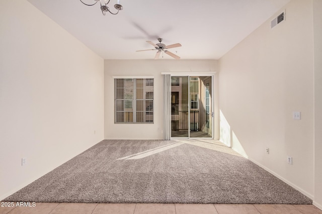 unfurnished room with light carpet and ceiling fan