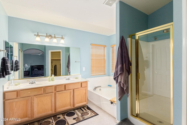 bathroom featuring vanity and plus walk in shower