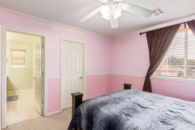 bedroom with ceiling fan, ornamental molding, and light carpet