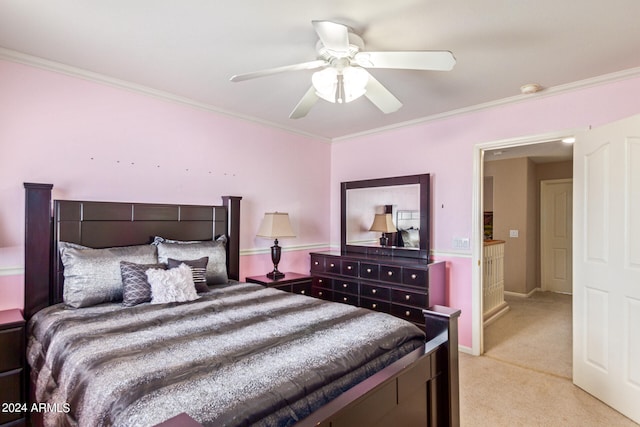 carpeted bedroom featuring crown molding and ceiling fan