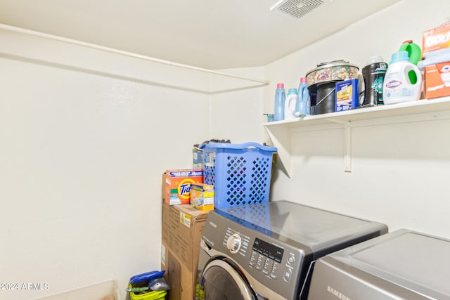 laundry area with independent washer and dryer