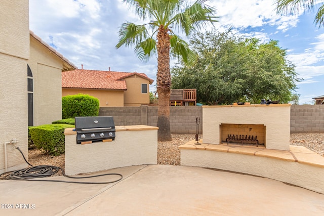 view of patio featuring a grill