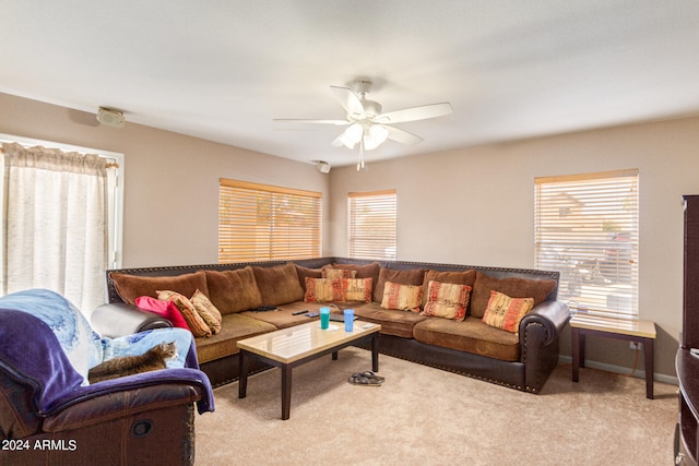 living room with ceiling fan and carpet floors