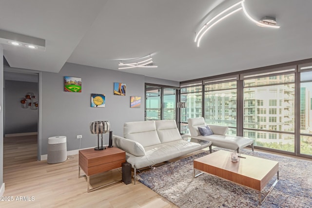 living room with light wood-type flooring and a wealth of natural light