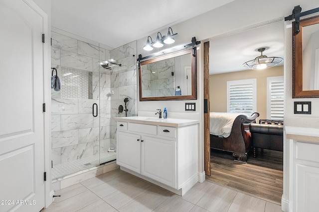 bathroom featuring tile patterned floors, vanity, and an enclosed shower