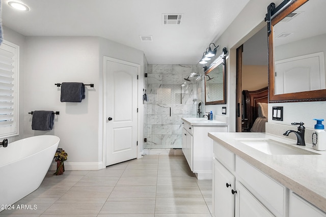 bathroom featuring tile patterned flooring, vanity, and independent shower and bath