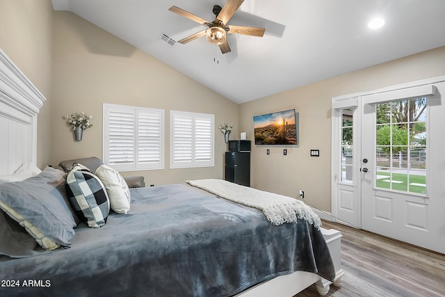 bedroom with access to exterior, ceiling fan, light hardwood / wood-style flooring, and vaulted ceiling