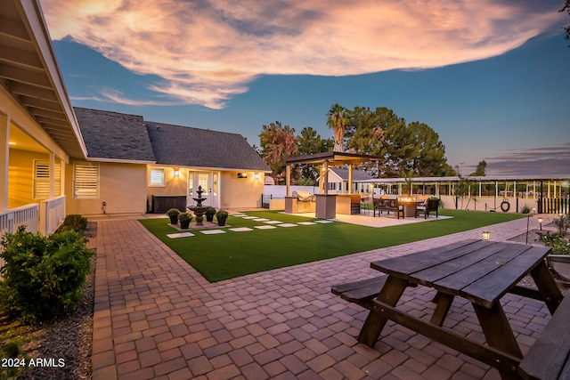 patio terrace at dusk with a lawn