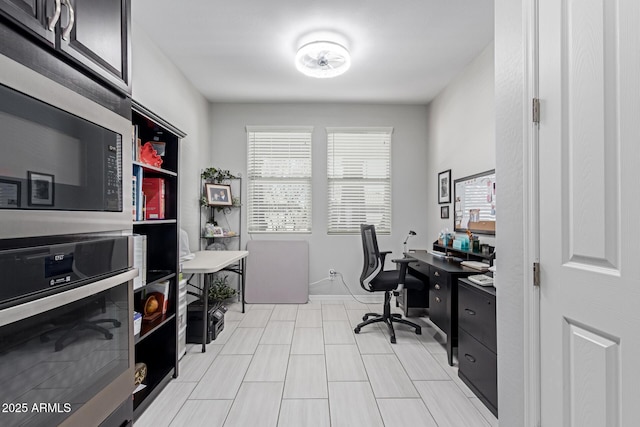 office space with baseboards